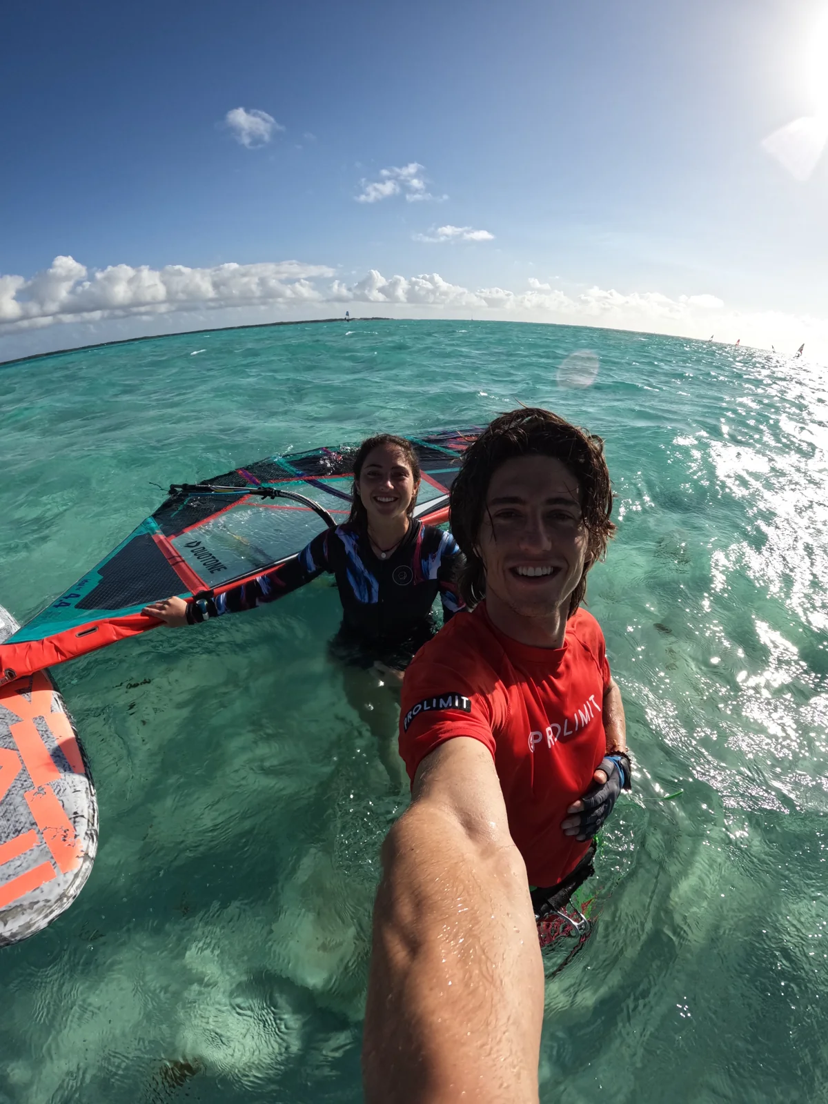 A shared moment with the windsurf crew on the water